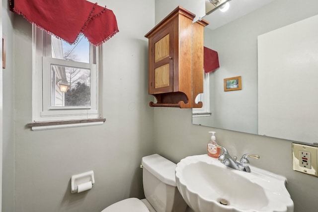 bathroom with sink and toilet