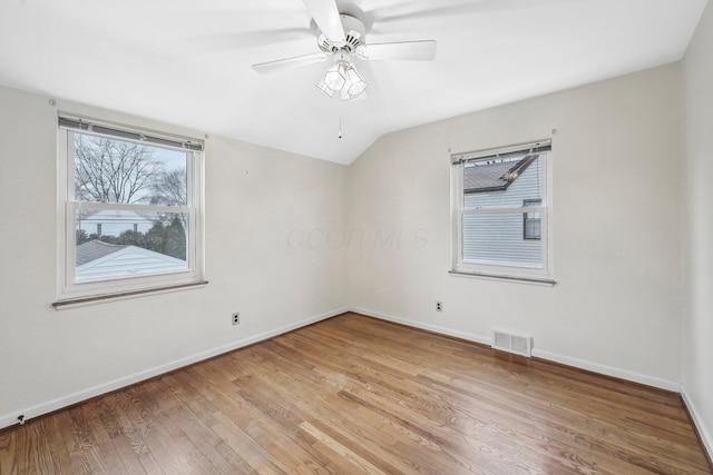 unfurnished room with hardwood / wood-style flooring, ceiling fan, and lofted ceiling