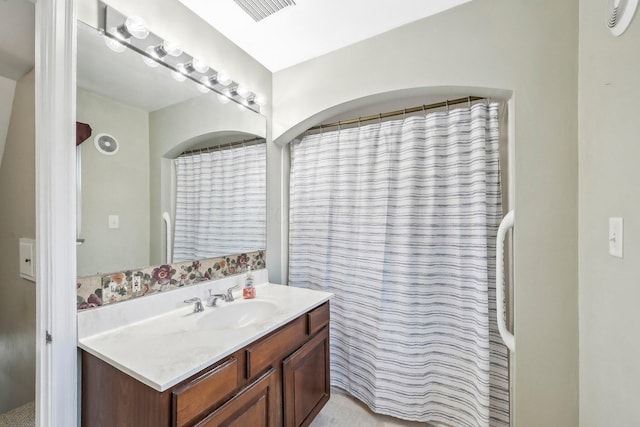 bathroom with vanity and a shower with curtain