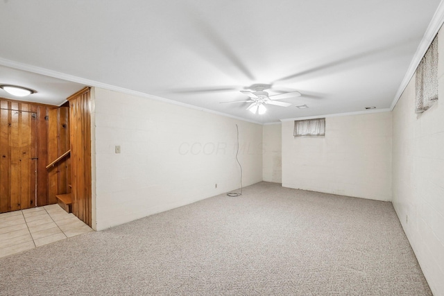 carpeted empty room with ceiling fan and ornamental molding