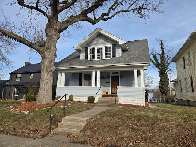 view of front facade with a porch and a front yard