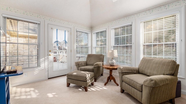 sunroom featuring vaulted ceiling