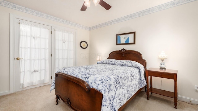 bedroom with a ceiling fan, baseboards, and light carpet