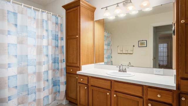 full bathroom with vanity and a shower with shower curtain