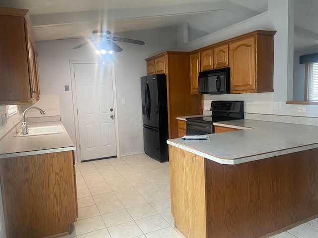 kitchen featuring tasteful backsplash, sink, kitchen peninsula, and black appliances