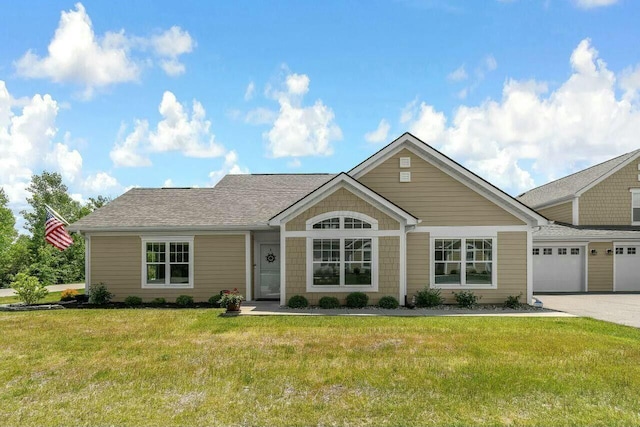 view of front facade featuring a garage and a front yard