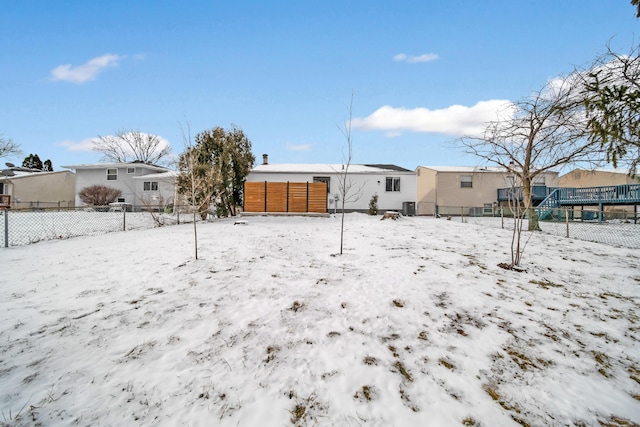 exterior space featuring fence and a residential view