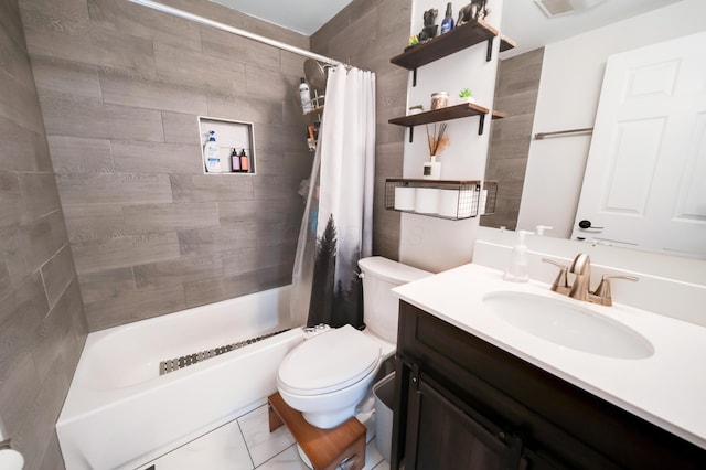 bathroom featuring toilet, shower / bath combo with shower curtain, and vanity