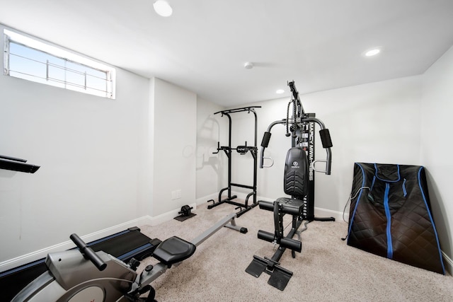 exercise room with recessed lighting and baseboards