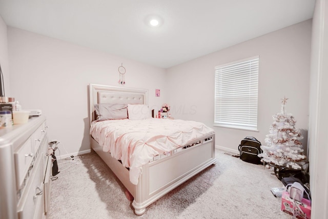 bedroom featuring light carpet