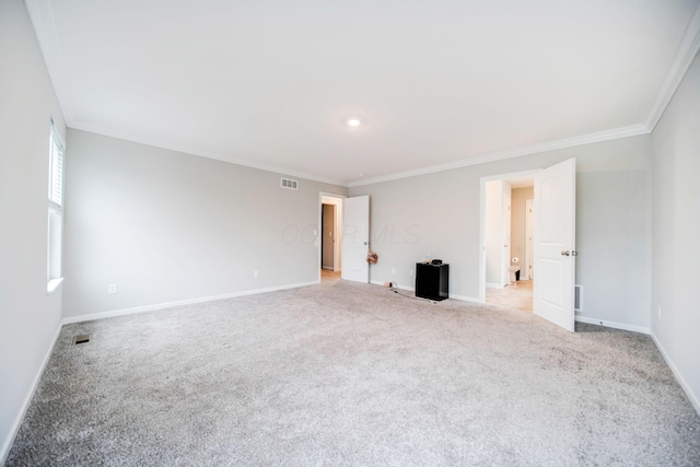 carpeted empty room with crown molding