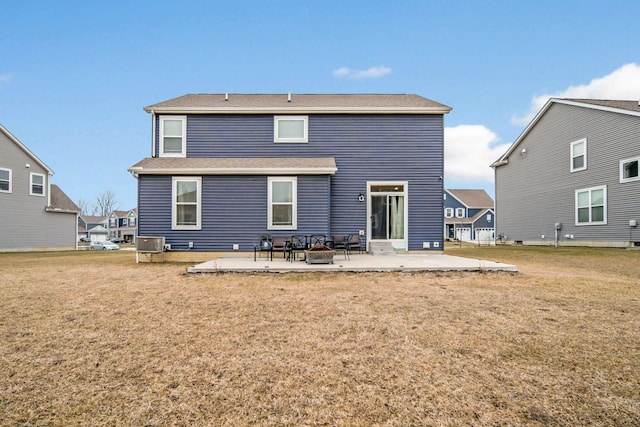 back of house with a yard and a patio area