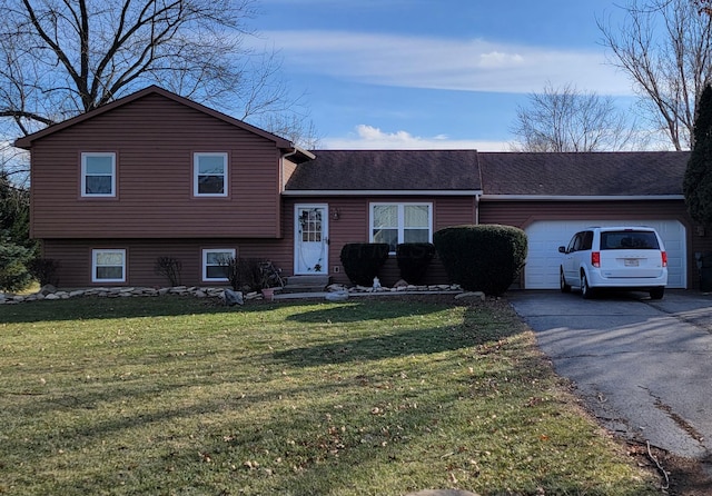 split level home with a garage and a front yard