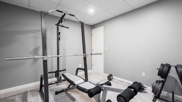 exercise area featuring a drop ceiling