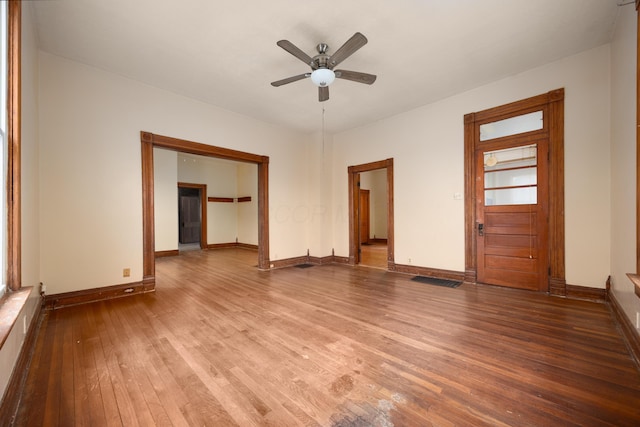 spare room with hardwood / wood-style floors and ceiling fan