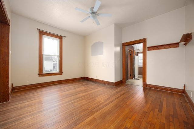 spare room featuring ceiling fan and wood-type flooring