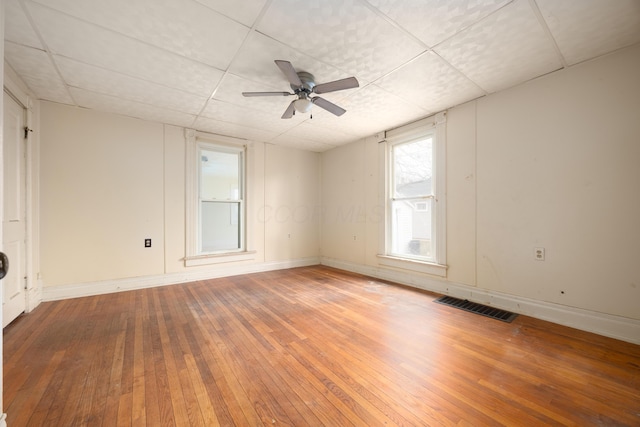 empty room featuring hardwood / wood-style flooring and ceiling fan