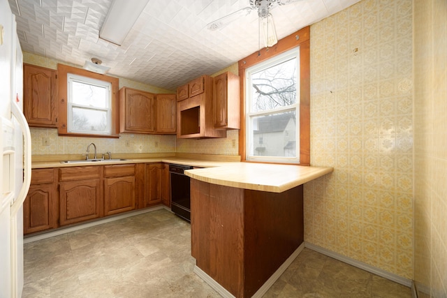 kitchen with sink, vaulted ceiling, kitchen peninsula, dishwasher, and white fridge with ice dispenser