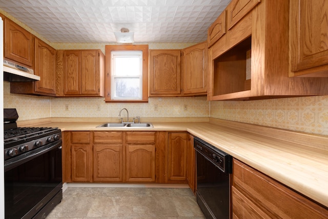 kitchen with sink and black appliances