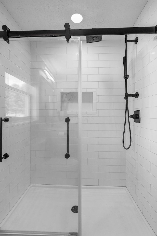 bathroom featuring a shower stall