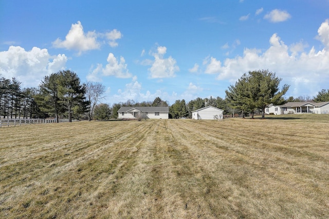 view of yard with a rural view