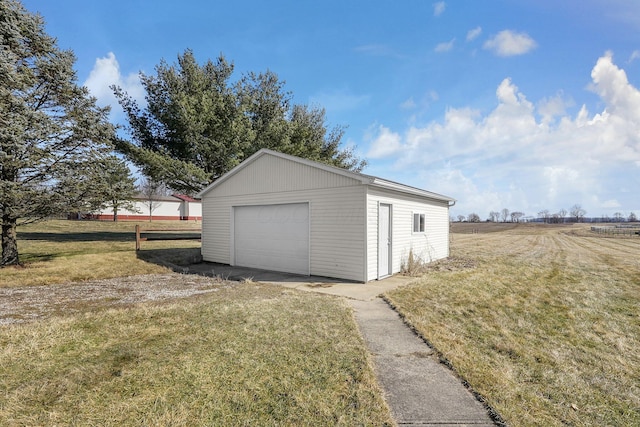 detached garage featuring driveway