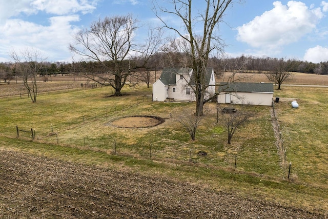 view of yard with a rural view