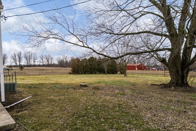 view of yard with a rural view