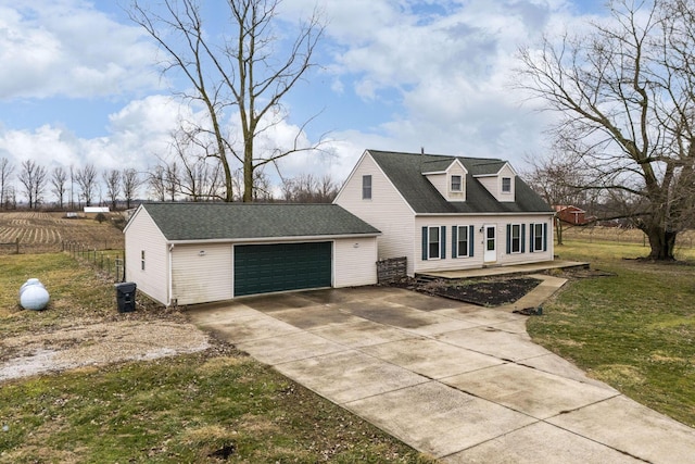 view of front of property with a garage and a front yard