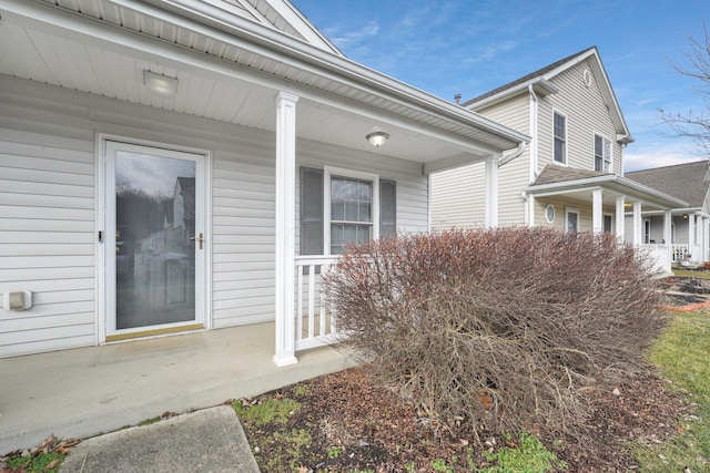 entrance to property featuring a porch