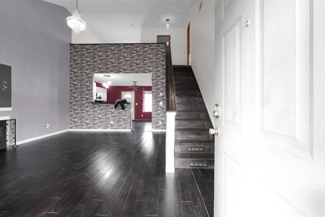 unfurnished living room featuring dark hardwood / wood-style flooring and ceiling fan