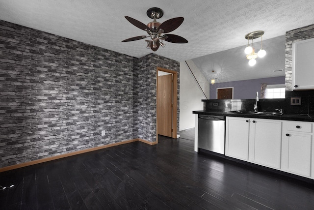 kitchen featuring sink, white cabinetry, dark hardwood / wood-style flooring, dishwasher, and pendant lighting