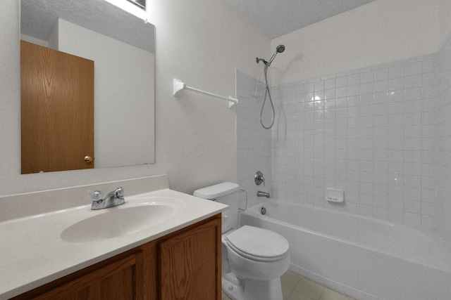 full bathroom with tiled shower / bath, vanity, and toilet