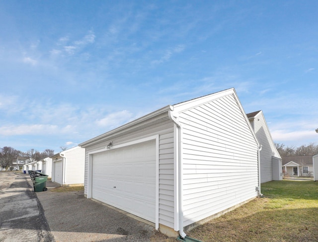 garage with a yard