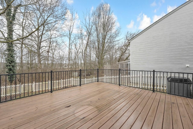 wooden deck featuring cooling unit