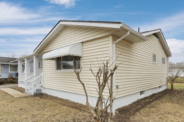 view of home's exterior featuring a lawn