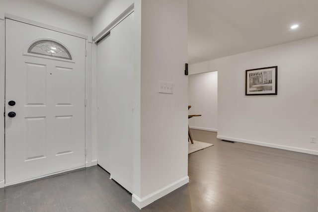 foyer with dark hardwood / wood-style floors