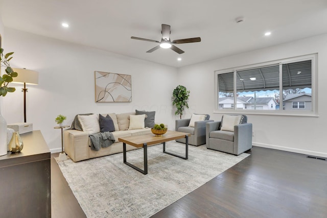 living room with ceiling fan and wood-type flooring