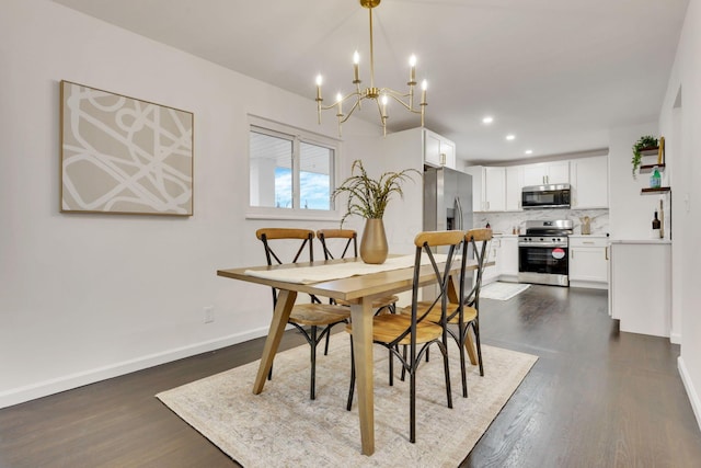 dining room with dark hardwood / wood-style floors