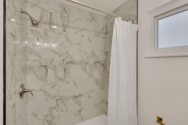 bathroom featuring a shower with curtain