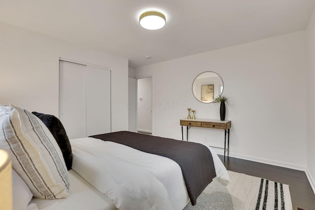 bedroom featuring a closet and dark hardwood / wood-style floors