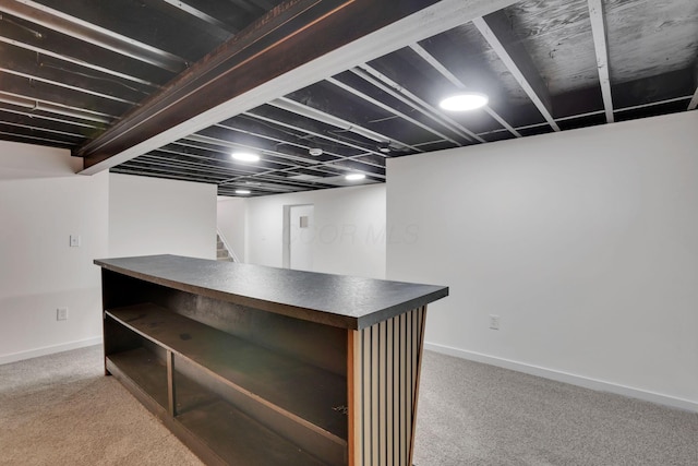 basement with light colored carpet