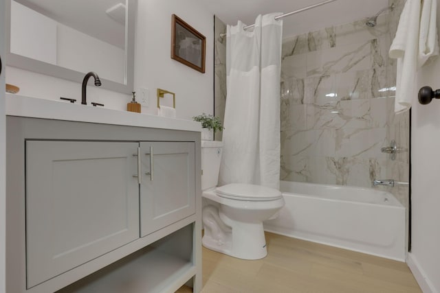 full bathroom with vanity, toilet, wood-type flooring, and shower / bath combo