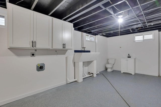 laundry room featuring a healthy amount of sunlight and hookup for an electric dryer