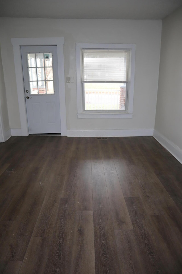 interior space with dark hardwood / wood-style flooring