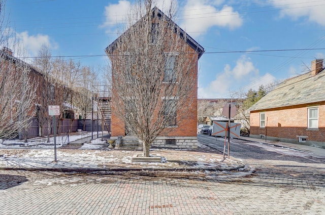 exterior space with crawl space and fence