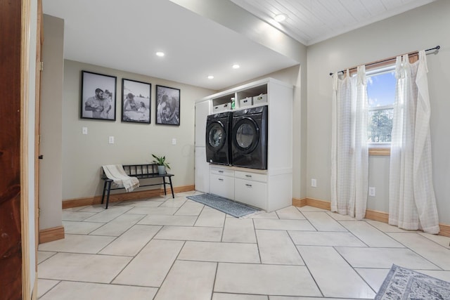 clothes washing area featuring light tile patterned floors, washing machine and dryer, baseboards, and recessed lighting