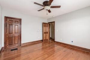 unfurnished bedroom with wood-type flooring and ceiling fan