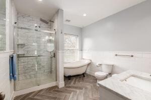 bathroom with vanity, parquet flooring, and a shower with shower door