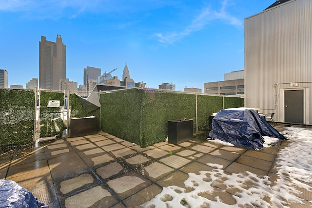 view of patio featuring a balcony